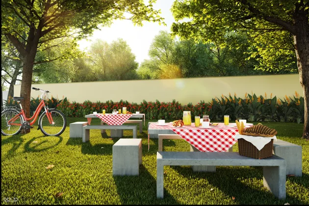 Bosque com mesas de piquenique, toalhas xadrez e uma bicicleta encostada